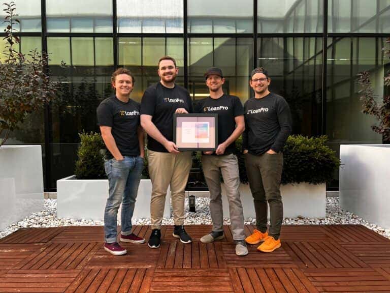 Photo of a group of LoanPro employees holding the Utah Business for transaction-level credit award Photo of a group of LoanPro employees holding the Utah Business for transaction-level credit award